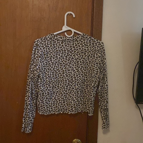 This is a Old Navy sweater. It’s buttoned up and it does button up and down. - Picture 2 of 2